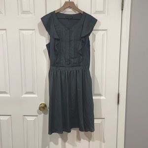 Charcoal colored dress.